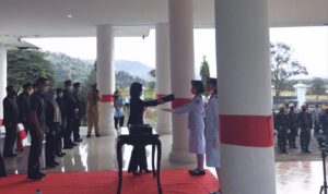 Bupati Bolmong Pimpin Upacara Pemindahan Duplikat Bendara Merah Putih