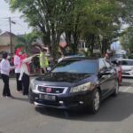 Peringati Hari AIDS Sedunia, Dinkes Kotamobagu Bagikan Bunga dan Brosur di Pusat Kota