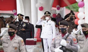 Tampak Bupati Bolsel, H. Iskandar Kamaru saat menghadiri upacara HUT Bhayangkara ke-76.