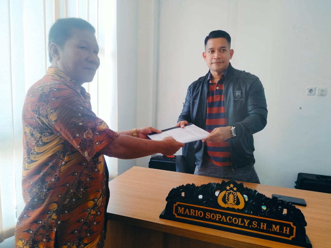 Polres Bolmut Resmi Terima Laporan Hasil Audit Desa Bolangitang Dua.